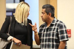 The Rev. Hector Coria talks with his attorney, Jessica Graves, at Tuesday's hearing in Yolo Superior Court